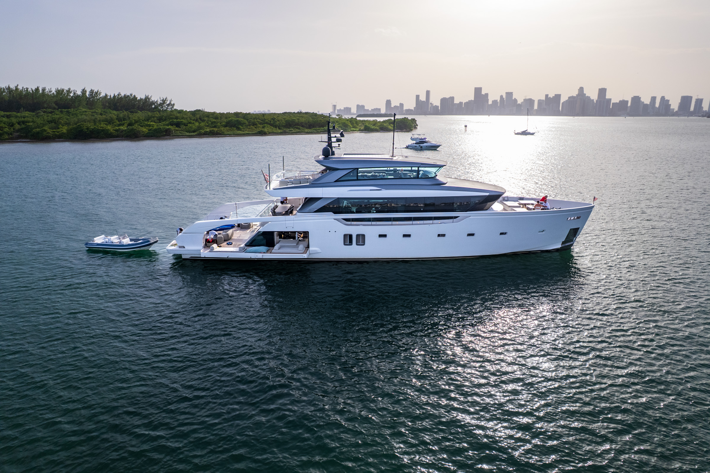 Superyacht underway against open horizon — private charter