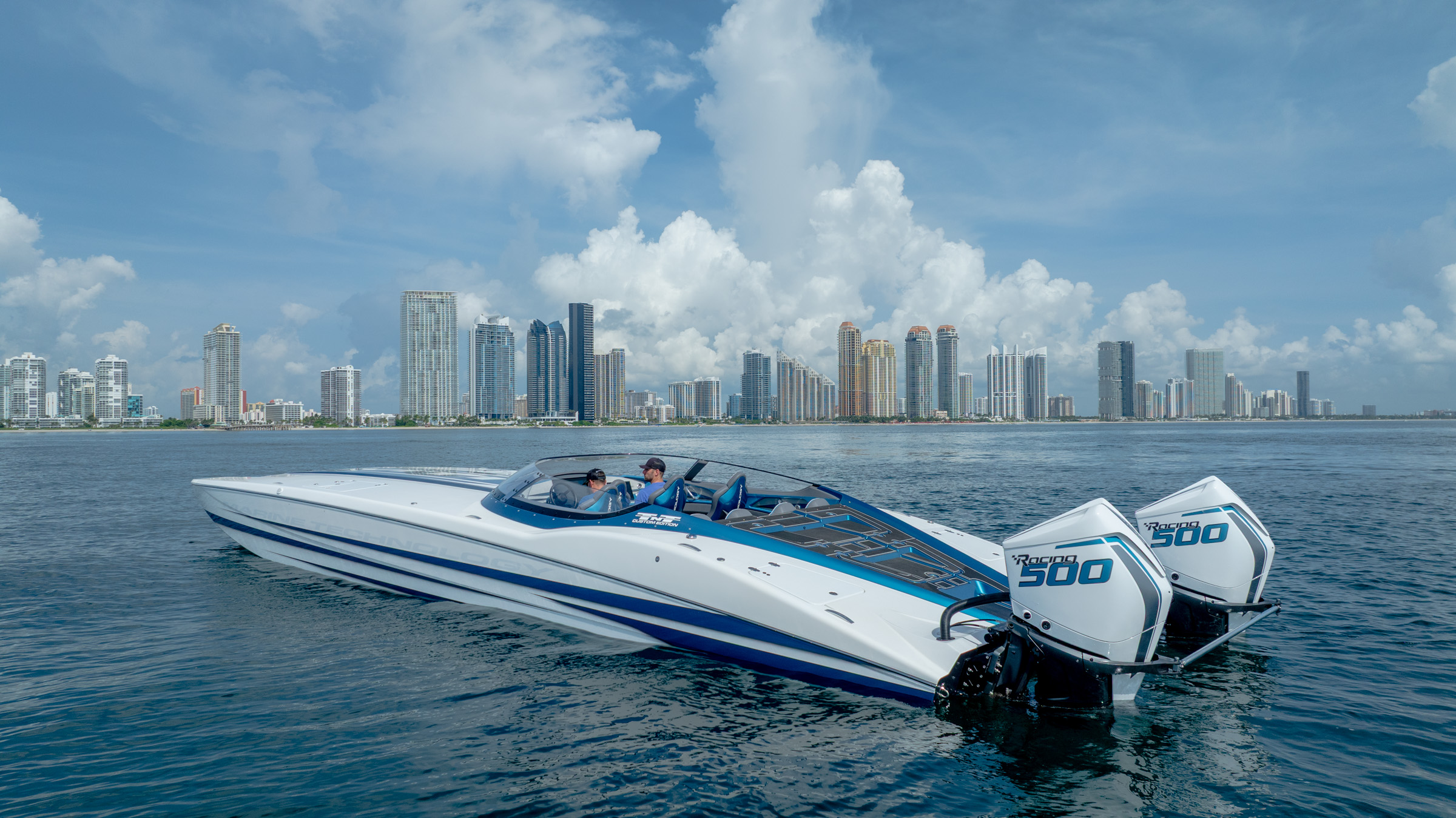 Performance vessel running off the Miami skyline at golden hour